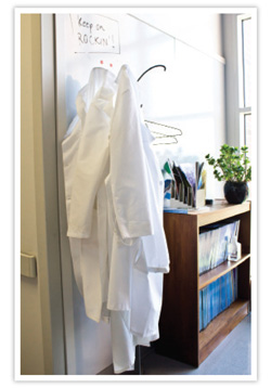 lab coats hanging in an office
