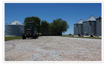 farm yard with silos and tractor