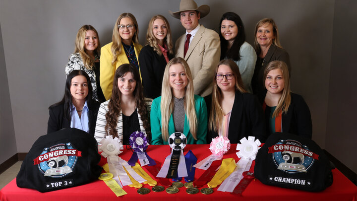 A horse judging team posing with their awards.